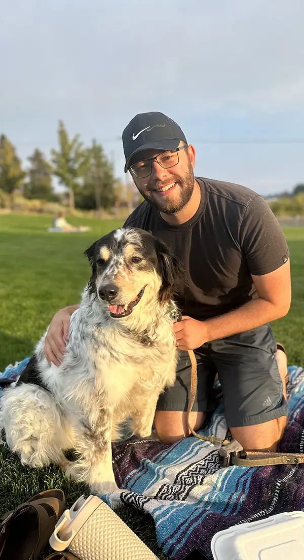  Dr. Jonathan enjoying the sun with his rescue dog Wally, who was adopted from OHS